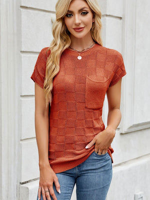 Textured knit pocket tee in rust orange with short sleeves and a crew neck.