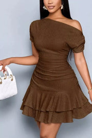 Brown one-shoulder tiered ruffle dress with ruched waist and short sleeves.