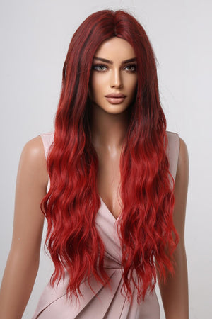 Crimson ombre synthetic wave wig with dark roots and long, wavy red hair.