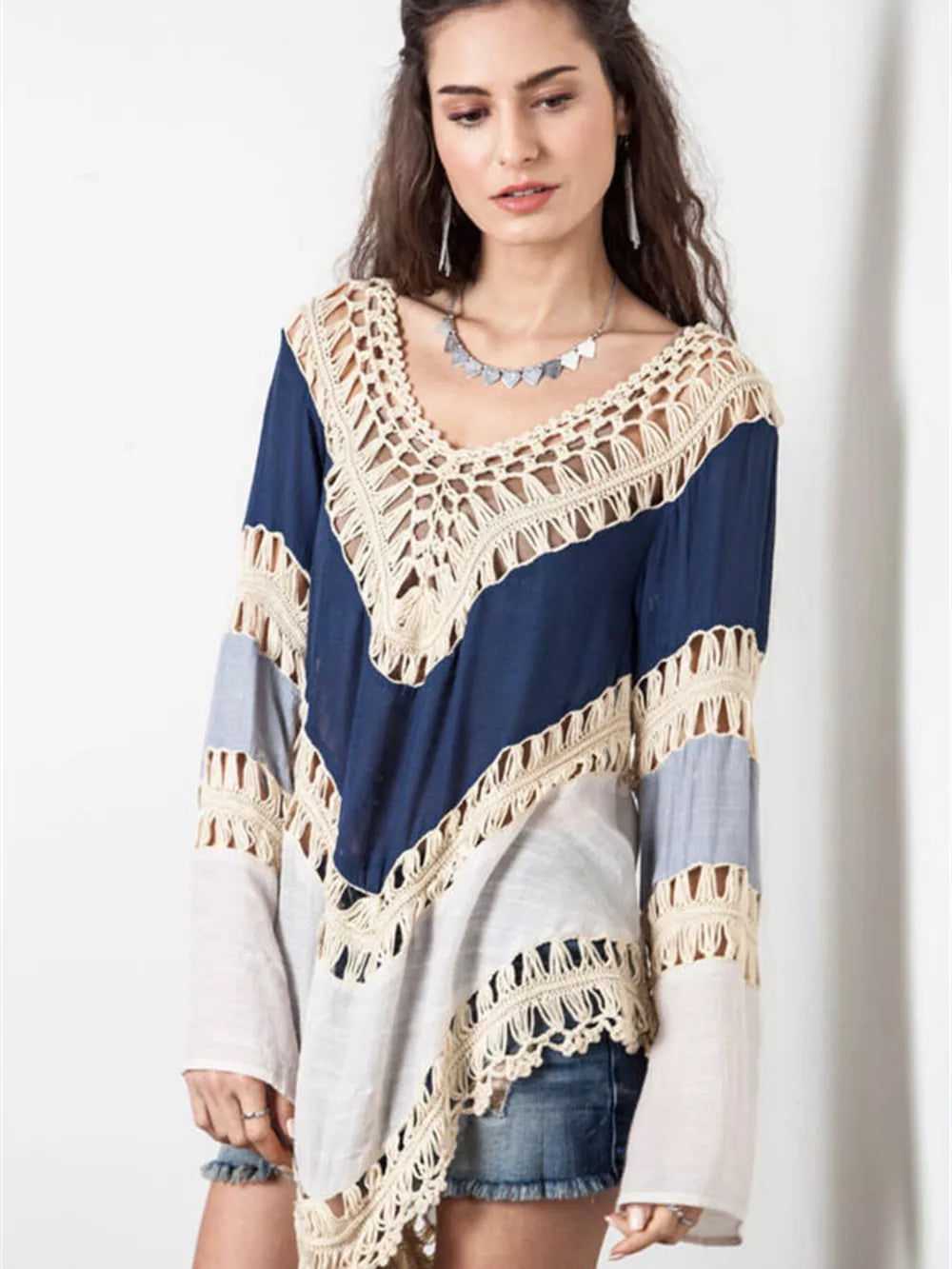 Crochet-trimmed long sleeve cardigan in blue and gray with cutout details.