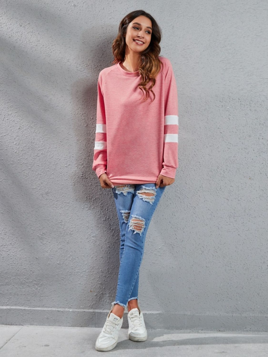 Varsity Stripe Raglan Sweatshirt Dress in burnt coral with white sleeve stripes, 100% polyester.