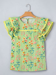 Green striped cotton blouse with floral print, ruffle sleeves, and yellow trim.