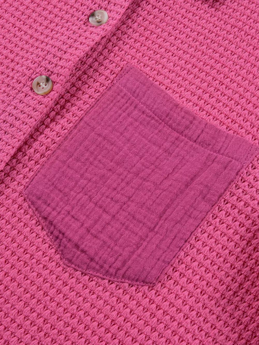Cerise waffle-knit button-down shirt with a contrasting gauze pocket and buttons.