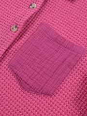 Cerise waffle-knit button-down shirt with a contrasting gauze pocket and buttons.