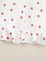 White cotton baby set with red heart print and ruffled hem