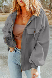 Textured grey utility hoodie jacket with zip front, chest pockets, and drawstring hood.
