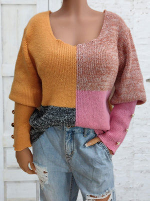 Colorblock knit sweater with button cuffs in sherbet colors, featuring a scoop neck and relaxed fit.