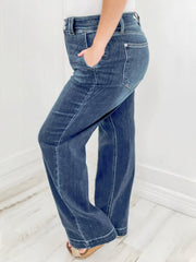 Dark wash denim wide leg jeans with utility pockets and a comfortable fit.