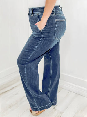 Dark wash denim wide leg jeans with utility pockets and a comfortable fit.