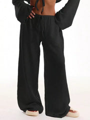 Black maternity wide-leg pants with drawstring waist and relaxed fit