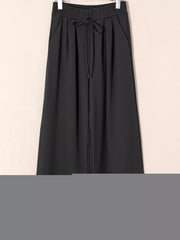 Black cotton maternity pants with drawstring high waist and pleats
