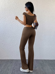 Ribbed off-shoulder crop top and flare pants set in chocolate brown.