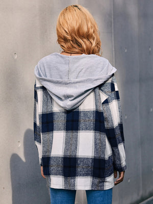Oversized plaid shacket in dark blue and white with a grey knit hood.