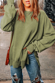 Oversized sage washed cotton sweatshirt with crewneck, side slits and cuffed sleeves.