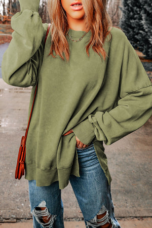 Oversized sage washed cotton sweatshirt with crewneck, side slits and cuffed sleeves.