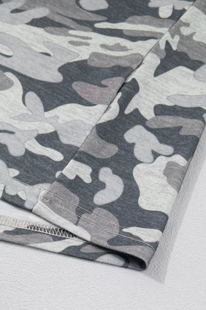 Camouflage relaxed V-neck tee with grey and white pattern.