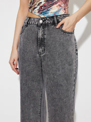 Acid wash high-rise flare jeans in dark gray cotton with button fly and pocket detail.