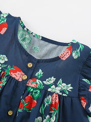 Navy blue cotton dress with strawberry print, ruffle sleeves, and button front.