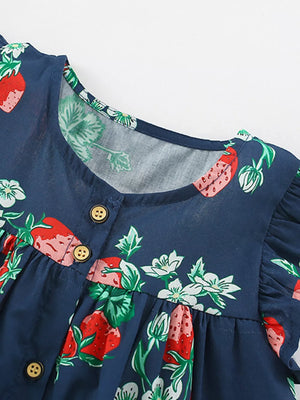 Navy blue cotton dress with strawberry print, ruffle sleeves, and button front.