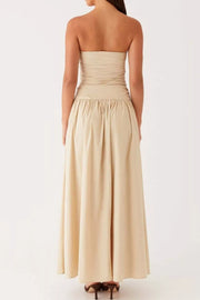Ruched strapless maxi dress in cream with a flowing skirt and gathered waist