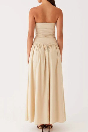 Ruched strapless maxi dress in cream with a flowing skirt and gathered waist