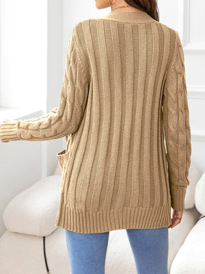 Camel knit cardigan with cable sleeves and ribbed texture.