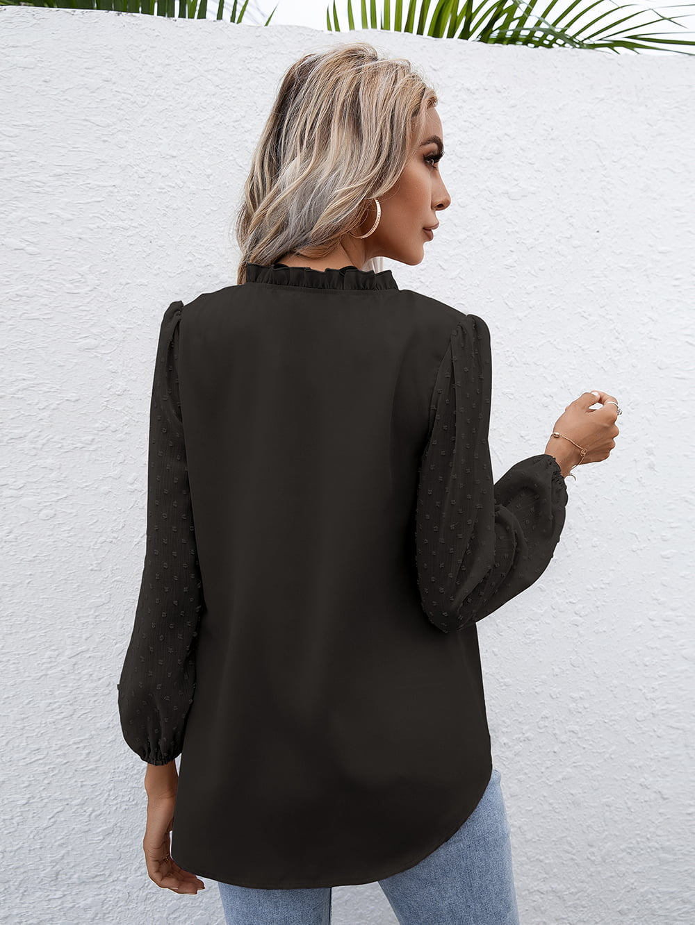 Black Swiss dot sleeve gathered blouse with ruffled neckline and balloon sleeves.