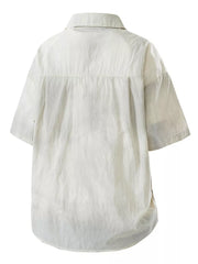 Relaxed fit camp collar men's shirt in off-white with short sleeves and a buttoned front.