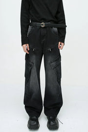 Baggy black denim cargo pants with zipper pockets and large side pockets.