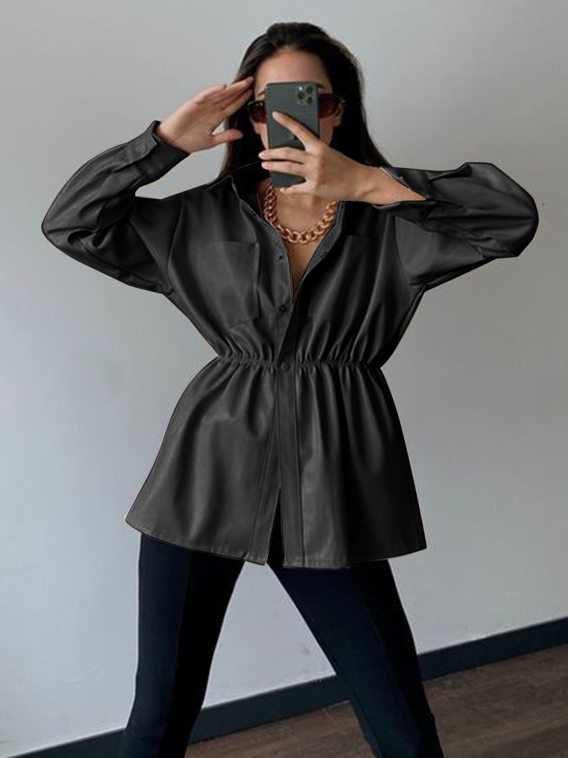 Black faux leather shirt jacket with gathered waist and button front