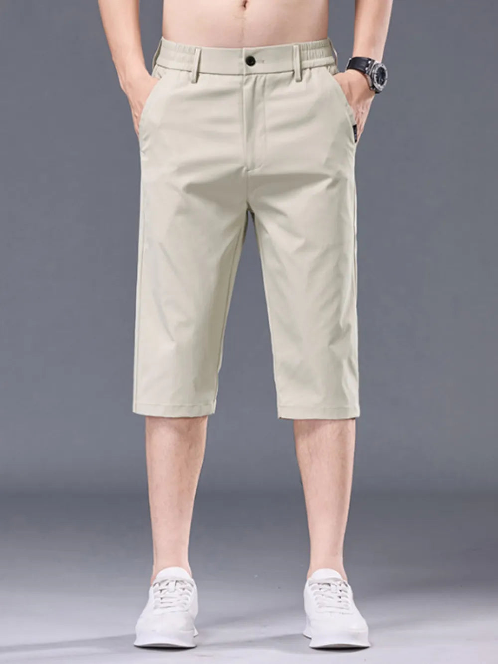 Men's apricot chino shorts with belt loops and pockets.