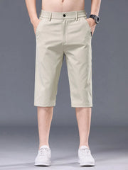 Men's apricot chino shorts with belt loops and pockets.