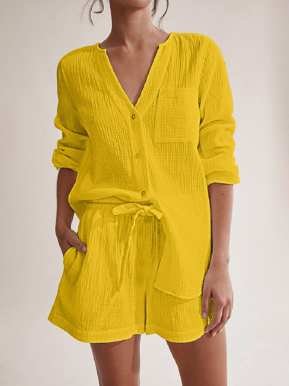 Yellow textured cotton pajama set with button-up top and drawstring shorts