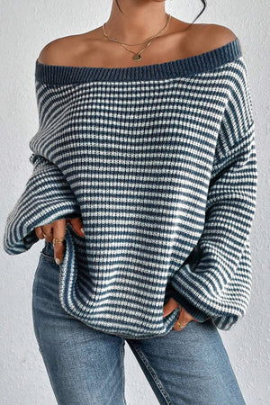 Off-shoulder blue striped knit pullover sweater with a relaxed fit.