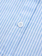 Blue and white striped button-down shirt with white buttons.