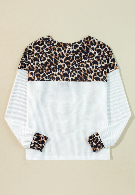 White waffle knit henley sweater with leopard print yoke and cuffs
