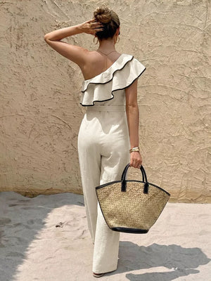 Elegant white one-shoulder romper with ruffles and black trim, belted waist, wide legs
