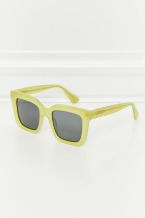 Citron box frame sunglasses with dark lenses and acetate frames.
