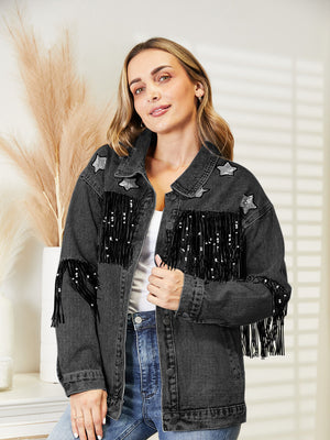 Black denim trucker jacket with star patches and sequin fringe detail.