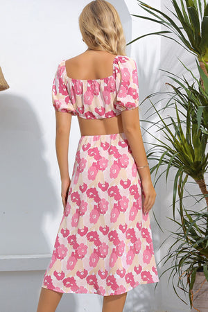 Pink floral midi dress with puff sleeves and cutout detail