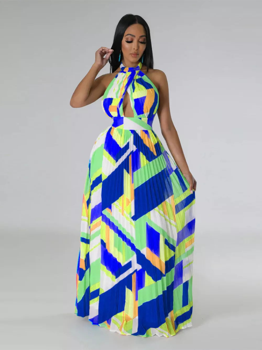 Halter neck pleated maxi dress with bold geometric print and cutout detail.