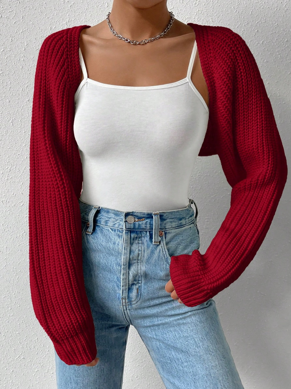Burgundy acrylic knit bolero shrug with long sleeves and ribbed texture.