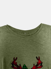 Matcha green tee with asymmetrical reindeer graphic and plaid detail.