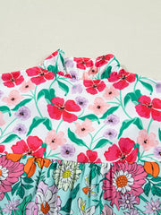 Maternity floral print overshirt with ruffled high neck and flutter sleeves.