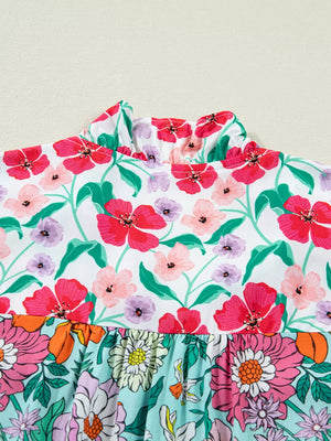 Maternity floral print overshirt with ruffled high neck and flutter sleeves.