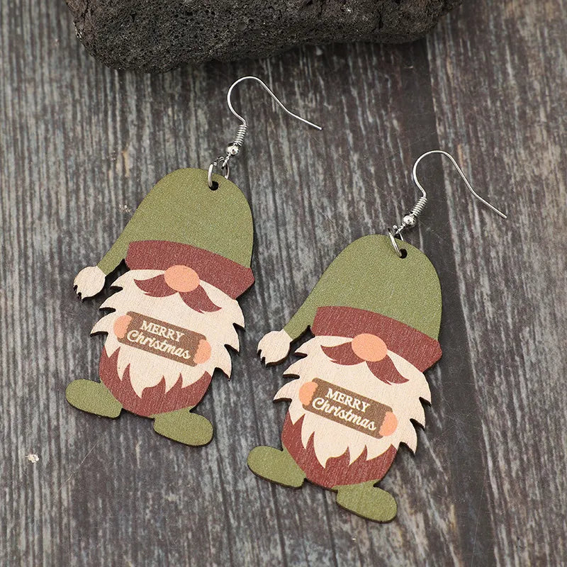 Merry Christmas gnome wood dangle earrings in matcha green with festive details.