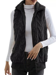 Black faux fur zip-up vest with chevron pattern and ribbed hem