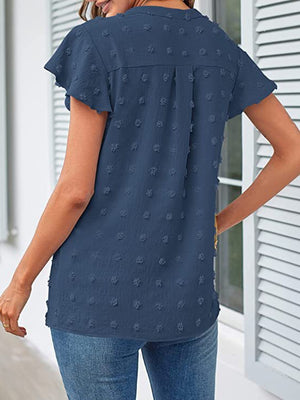 Dusty Blue flutter sleeve Swiss dot blouse with a V-neck and short sleeves.