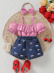 Pink ruffle top with puff sleeves and denim shorts with bow print, includes headband