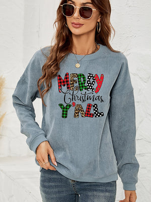 Light blue corduroy sweatshirt with Merry Christmas Y'all graphic in buffalo plaid, leopard, and polka dot patterns.